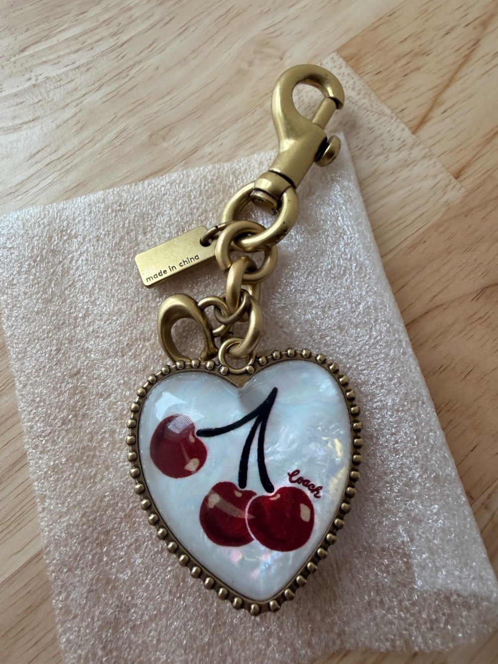COACH CHARM VINTAGE HEART Cherry paint.